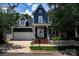 Charming two-story home with a welcoming front porch, two car garage, and professionally landscaped front yard at 138 Blandina Ct, Fort Mill, SC 29708