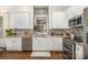 Well-lit kitchen with granite countertops, mosaic backsplash, and stainless-steel appliances at 138 Blandina Ct, Fort Mill, SC 29708