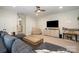 Spacious living room with a large couch, carpeted floors, TV, and plenty of natural light at 138 Blandina Ct, Fort Mill, SC 29708
