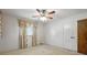 Inviting bedroom featuring neutral carpet, patterned curtains, and closet for storage at 13909 Idlewild Rd, Matthews, NC 28105