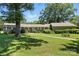 Charming single-story brick home with manicured lawn and mature trees, offering great curb appeal at 13909 Idlewild Rd, Matthews, NC 28105