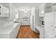 Bright white kitchen featuring modern appliances, laminate floors and ample counter space, ready for cooking at 13909 Idlewild Rd, Matthews, NC 28105