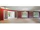 Expansive living room with carpet, bright windows and a charming chandelier enhancing the atmosphere at 13909 Idlewild Rd, Matthews, NC 28105