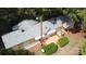 Aerial view of a home with a wooden deck, mature trees, and satellite dish at 1409 Turner Dr, Gastonia, NC 28052