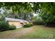 Spacious backyard featuring mature trees and plenty of green space at 1409 Turner Dr, Gastonia, NC 28052