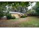 Large backyard featuring mature trees and plenty of green space at 1409 Turner Dr, Gastonia, NC 28052