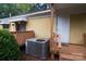 Exterior view of a deck, side of home, with an air conditioning unit at 1409 Turner Dr, Gastonia, NC 28052