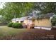 Charming single-story house featuring a well-maintained lawn and inviting entrance at 1409 Turner Dr, Gastonia, NC 28052