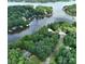 Aerial view highlighting the property's lake access and lush surroundings at 143 Uwharrie Ct # 10801081, Mount Gilead, NC 27306