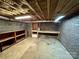 Spacious unfinished basement with block walls, providing ample storage and potential for customization at 143 Uwharrie Ct # 10801081, Mount Gilead, NC 27306
