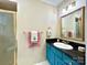 Bathroom features vibrant blue vanity and ornate gold mirror at 143 Uwharrie Ct # 10801081, Mount Gilead, NC 27306
