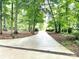 A long driveway leading to a secluded, beautiful home at 143 Uwharrie Ct # 10801081, Mount Gilead, NC 27306