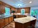 Well-appointed kitchen with wood cabinets, granite countertops, stainless steel appliances, and ample storage at 143 Uwharrie Ct # 10801081, Mount Gilead, NC 27306