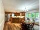 Well-equipped kitchen with wooden cabinets, stainless steel appliances, granite countertops, and dining area at 143 Uwharrie Ct # 10801081, Mount Gilead, NC 27306