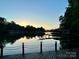 Beautiful lake view showing the sunset and the calm lake waters at 143 Uwharrie Ct # 10801081, Mount Gilead, NC 27306