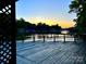 Scenic lake view from the wooden deck with colorful sunset at 143 Uwharrie Ct # 10801081, Mount Gilead, NC 27306