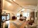 Comfortable living room with a stone fireplace, vaulted ceilings, and hardwood floors for a relaxing ambiance at 143 Uwharrie Ct # 10801081, Mount Gilead, NC 27306