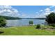 Picturesque lakefront view with a private dock and multiple boats, ideal for watersports enthusiasts at 143 Uwharrie Ct # 10801081, Mount Gilead, NC 27306