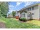 View of a backyard with the home exterior, wood deck, and a wood gazebo at 14333 Maclauren Ln, Huntersville, NC 28078