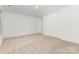 Neutral bedroom with carpet flooring, light colored walls, and two doors at 14333 Maclauren Ln, Huntersville, NC 28078