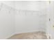 Walk-in closet featuring carpet flooring and wire shelving for ample storage space at 14333 Maclauren Ln, Huntersville, NC 28078