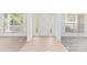 Bright foyer featuring tile flooring, decorative door windows, and ample natural light, creating a welcoming entrance at 14333 Maclauren Ln, Huntersville, NC 28078