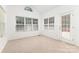 Bright sun room with many windows allowing for plentiful natural light, as well as tile flooring at 14333 Maclauren Ln, Huntersville, NC 28078