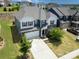 Aerial view of a charming home with well-manicured lawn and driveway nestled within a lovely neighborhood at 15119 Oleander Dr, Charlotte, NC 28278