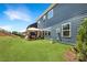 Well-maintained backyard featuring a pergola-covered seating area and lush green lawn at 15119 Oleander Dr, Charlotte, NC 28278