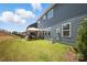 Backyard featuring a well-maintained lawn and cozy gazebo seating area, perfect for outdoor relaxation and entertainment at 15119 Oleander Dr, Charlotte, NC 28278
