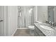This bathroom offers a glass-enclosed shower and granite vanity at 15119 Oleander Dr, Charlotte, NC 28278