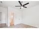 A simple, clean bedroom with ceiling fan, closet, and an attached bathroom with glass shower at 15119 Oleander Dr, Charlotte, NC 28278