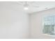 Bright bedroom featuring a window, a ceiling fan, and neutral colored walls at 15119 Oleander Dr, Charlotte, NC 28278