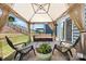 Patio under the gazebo with comfortable seating area, decorative rug and flower pots, offering a cozy outdoor retreat at 15119 Oleander Dr, Charlotte, NC 28278