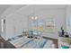 Cozy dining area with vaulted ceilings, natural light, and stylish decor at 1527 Scarbrough Sw Cir, Concord, NC 28025
