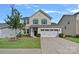 Charming two-story home with blue shutters, attached garage and beautiful lawn at 1527 Scarbrough Sw Cir, Concord, NC 28025