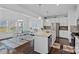 Open concept kitchen with stainless steel appliances, center island, and adjacent dining area at 1527 Scarbrough Sw Cir, Concord, NC 28025