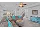 Inviting living room with staircase, plush sofa, and open view to kitchen at 1527 Scarbrough Sw Cir, Concord, NC 28025