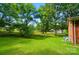 Expansive, green backyard with large trees provides a serene outdoor space at 1535 Maplewood Ave, Lancaster, SC 29720