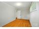 This bedroom features hardwood floors and a convenient closet for storage at 1535 Maplewood Ave, Lancaster, SC 29720
