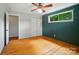 Large bedroom with wood floors, a ceiling fan, and a closet creating a functional and versatile space at 1535 Maplewood Ave, Lancaster, SC 29720