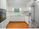 Bright kitchen features new appliances, white cabinets, countertops, and ample storage for cooking and preparing meals at 1535 Maplewood Ave, Lancaster, SC 29720