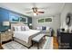 Spacious main bedroom with an elegant bed, seating, and a ceiling fan enhancing comfort and appeal at 1535 Maplewood Ave, Lancaster, SC 29720