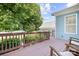 Enjoy outdoor living on this spacious back deck with brown railings, and views of the beautifully landscaped backyard at 15838 Trenton Place Rd, Huntersville, NC 28078