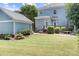 Expansive backyard featuring a well-manicured lawn, patio area, and deck, ideal for outdoor entertaining and recreation at 15838 Trenton Place Rd, Huntersville, NC 28078