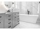 Bright bathroom features a soaking tub, double vanities, and elegant marble finishes, creating a spa-like retreat at 15838 Trenton Place Rd, Huntersville, NC 28078