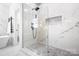 Elegant bathroom boasts a glass-enclosed shower with marble tiles, modern fixtures, and stylish design elements at 15838 Trenton Place Rd, Huntersville, NC 28078
