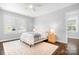 Bright bedroom features a comfortable bed, neutral decor, and natural light, offering a serene retreat at 15838 Trenton Place Rd, Huntersville, NC 28078