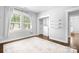 Bright bedroom featuring sleek hardwood floors, a walk-in closet, and recessed lighting at 15838 Trenton Place Rd, Huntersville, NC 28078
