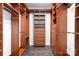 Spacious walk-in closet with custom shelving and storage, providing ample space for organization and style at 15838 Trenton Place Rd, Huntersville, NC 28078